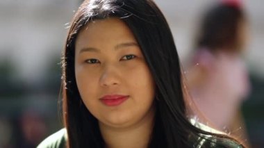 Portrait Asian young woman portrait outside, Japanese descent