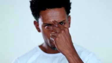 Tough looking serious African man posing to camera rejecting with finger portrait