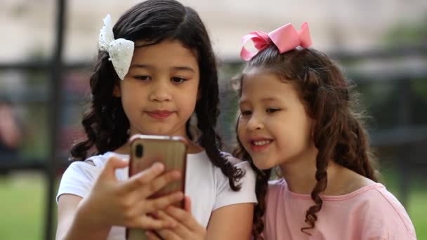 Children Looking Cellphone Park Two Little Girls Sisters Holding Smartphone — Video