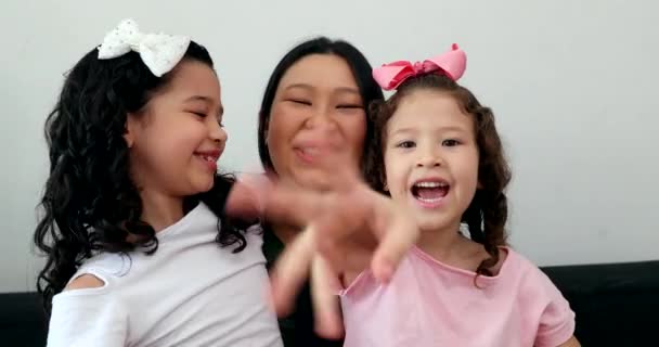 Asian Mother Waving Hello Camera Holding Multi Ethnic Little Girls — Stockvideo