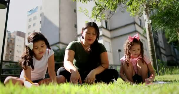 Asian Mother Helping Daughters Homework Park — Video