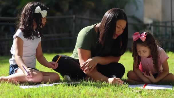 Asian Mother Sitting Little Daughters Helping Homework Kids Drawing Sunlight — Video