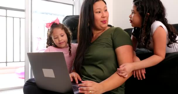 Mother Multi Tasking Using Computer Laptop Home While Parenting Two — Vídeo de Stock