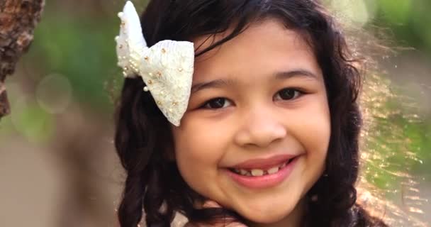 Portrait Mixed Race Little Girl Child Smiling Camera Park — Vídeo de Stock