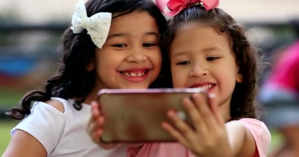 Two Little Girls Posing Selfie Smartphone Children Take Photo Front — Stockvideo