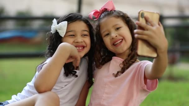 Cute Little Girls Taking Selfie Together Cellphone Park — Video