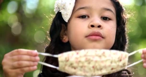 Child Trying Put Covid Face Mask Nature — Vídeo de Stock