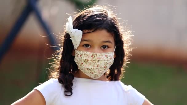 Little Girl Child Wearing Face Mask Looking Camera — Stock videók