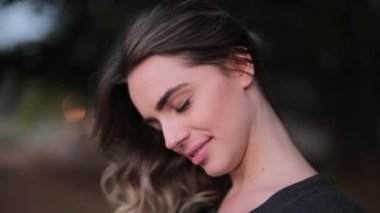 Pretty girl smiling to camera. Portrait of young woman starring camera hypnotic spell