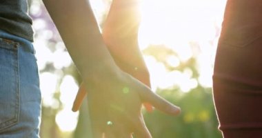 Friends holdings hand together in line