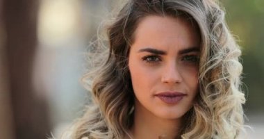 Pretty hispanic latin girl looking to camera emotionall going from serious to happy