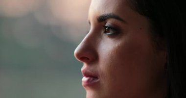Hispanic Young woman opening eyes outside, relaxing and enjoying outdoors