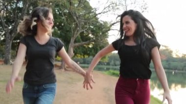 LGBT couple runing holding hands