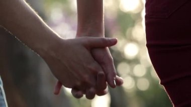 Disjoining hands. Couple lettings go separating hands