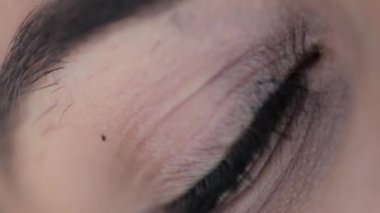 Macro close-up of green female eye outdoors