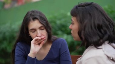 Depressed woman suffering with the help and support of female friend. Two women having EMPATHY. Sad person recovering from TRAUMA