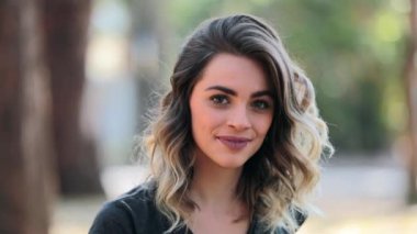 Portrait of girl looking up smilaing and laughing to camera