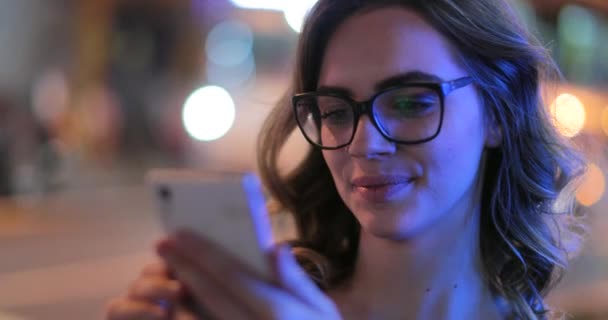 Young Woman Checking Her Cellphone Night — Video Stock