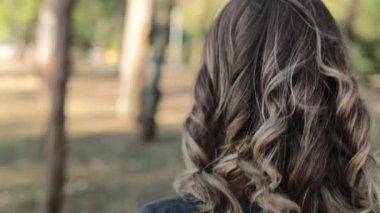 Back of a girl walking outdoors