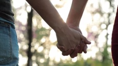 Disjoining hands held together, speration, splitting letting go of connection