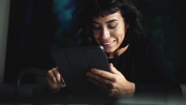 South American Woman Holding Tablet Device Looking Content Online — Stock Video