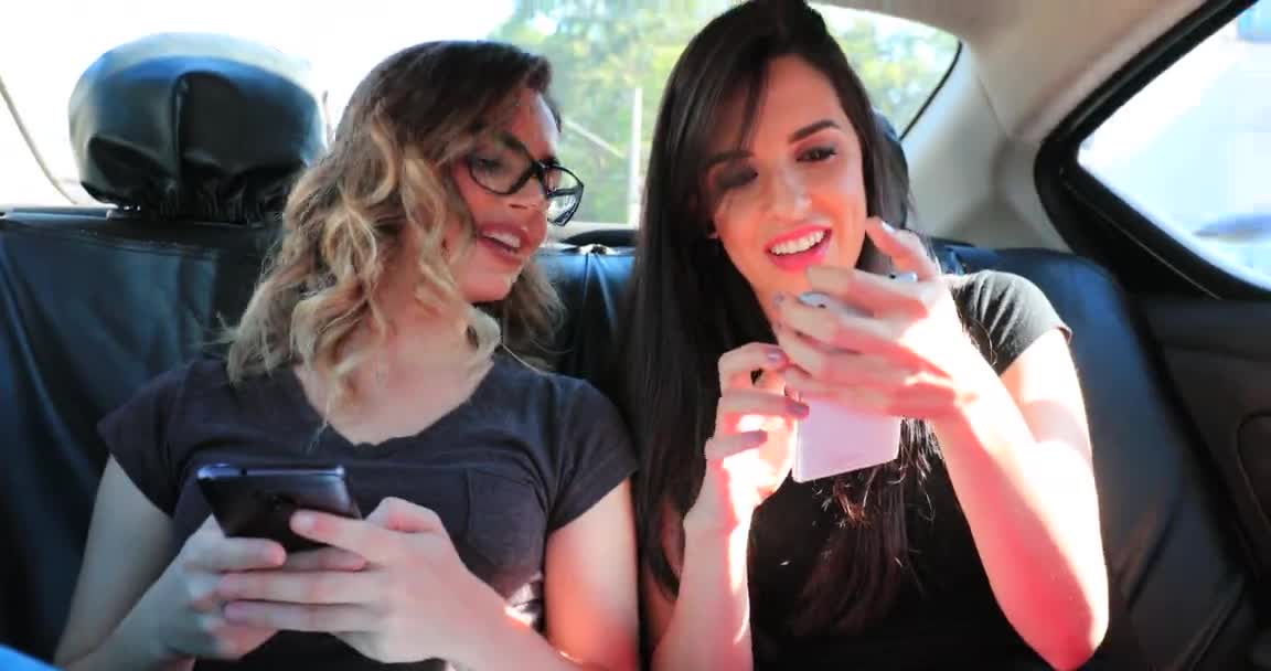 Friends Together Back Seat Taxi Holding Cellphones Checking Messages — Stockvideo