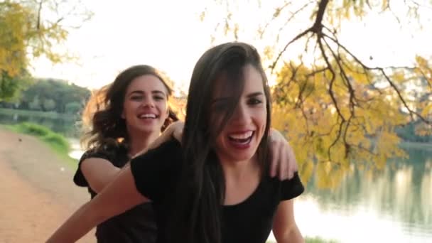 Girl Piggy Backing Friend Back Sunset Golden Hour Friends Piggy — Video