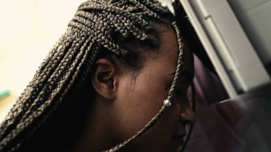 Troubled person suffering alone looking at bathroom mirror suffering having regret