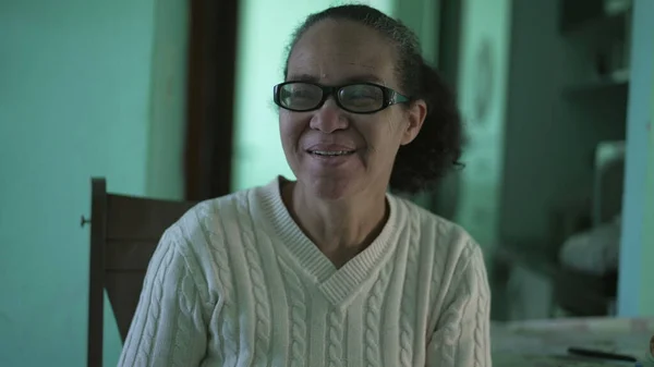 A happy senior hispanic older woman smiling at camera. An older south american person portrait