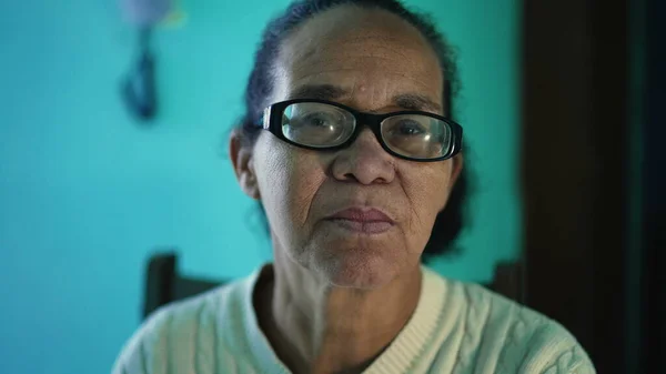 An African American senior woman portrait closeup face. A black elderly hispanic person