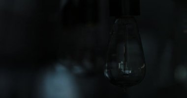 Light bulb illuminates room. Light being turned ON and OFF