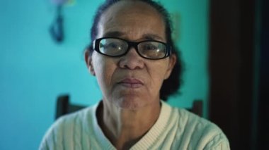 An African American senior woman portrait closeup face. A black elderly hispanic person