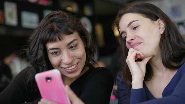 Two Young Women Looking Smartphone Device Screen Smiling Female Friends — Fotografia de Stock