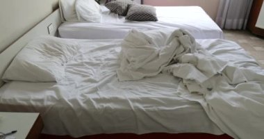 Messy bed sheets disarranged