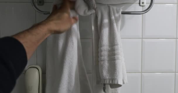 Person Putting Away Shower Towel — Wideo stockowe
