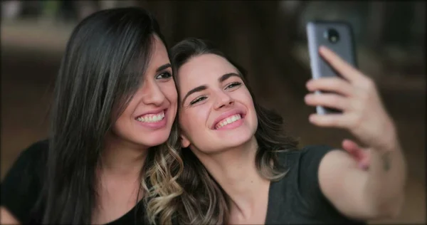 Girlfriends Taking Selfie Sticking Tongue Out Young Women Posing Photo — Stockfoto