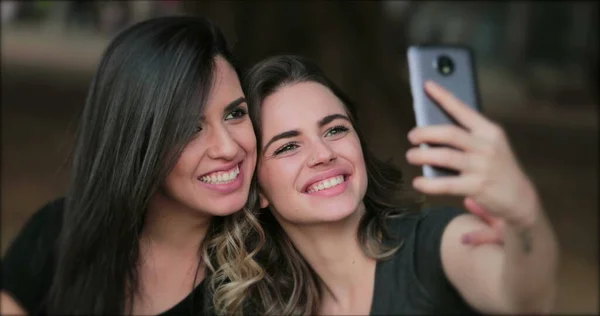 Girlfriends Taking Selfie Sticking Tongue Out Young Women Posing Photo — Fotografia de Stock