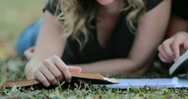 Girl Turning Page Book Lying Grass Outdoors Woman Reading Book — 图库照片