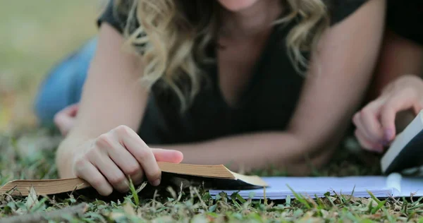 Girl Turning Page Book Lying Grass Outdoors Woman Reading Book — 图库照片