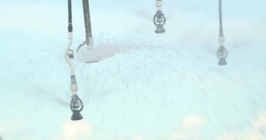 Pivot sprinkler system irrigating crops. Irrigation pivot system watering agriculture field 