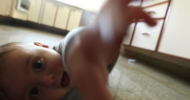 Casual Baby Boy Layed Kitchen Table Wanting Touch Camera — Stockvideo