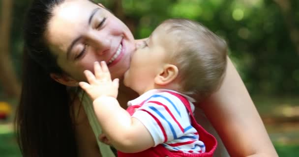 Adorable Cute Baby Infant Biting Mother Cheek Happy Caring Relationship — ストック動画