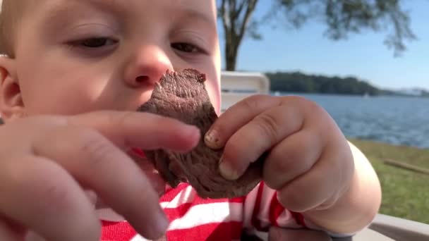 Closeup Baby Face Eating Piece Meat Meal Lunch — Vídeos de Stock