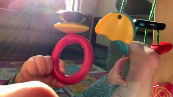 Closeup Baby Hands Holding Toy Hand — Vídeos de Stock