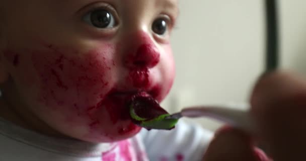 Feeding Messy Cute Baby Infant Covered Red Sauce — Stockvideo