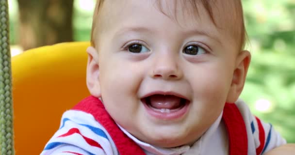Closeup Baby Boy Infant Playground Park Swing — Vídeo de Stock