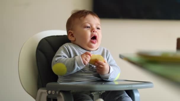 Sweet Baby Boy Highchair Open Mouth Adjusting Food — Vídeos de Stock