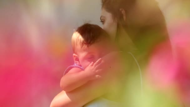 Beautiful Dreamlike Moment Mother Hugging Baby Outdoors — Stockvideo