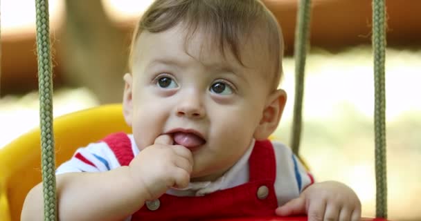 Happy Joyful Baby Boy Infant Playground Park Swing Smiling Touching — Stock Video