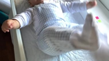 Infant baby boy toddler feeling happy blond child